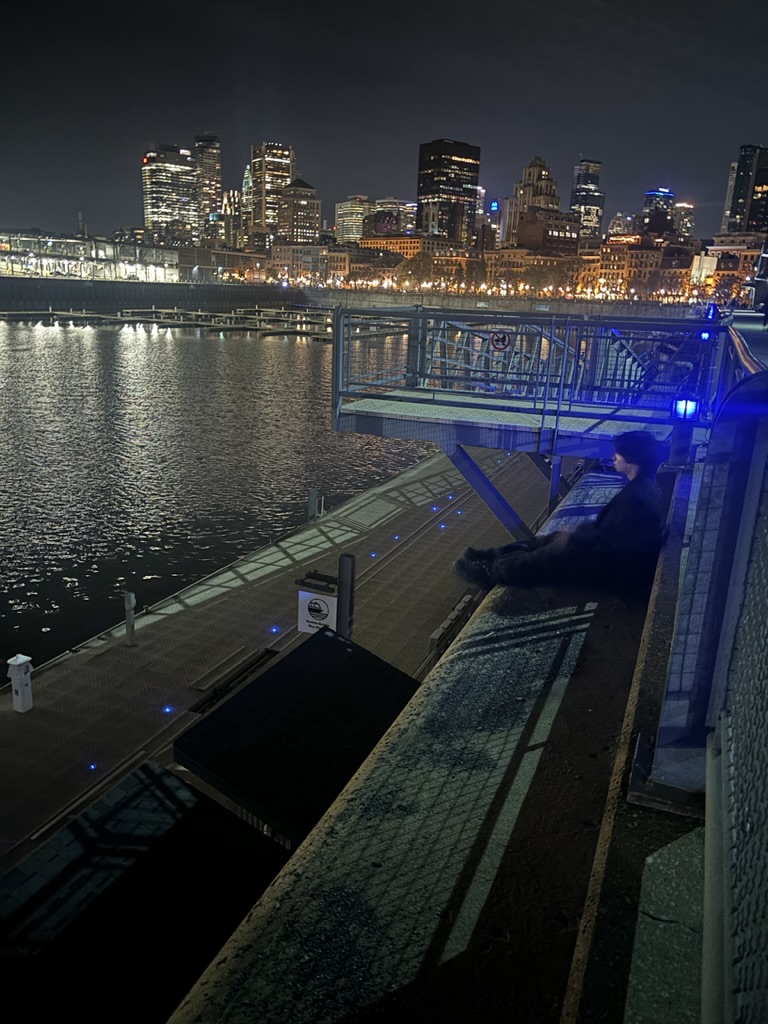 Roy by the waterfront at night
